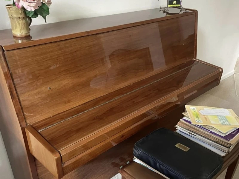 Unsure, upright piano