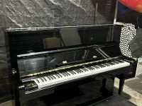 Tokai upright black piano