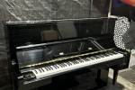 Tokai upright black piano