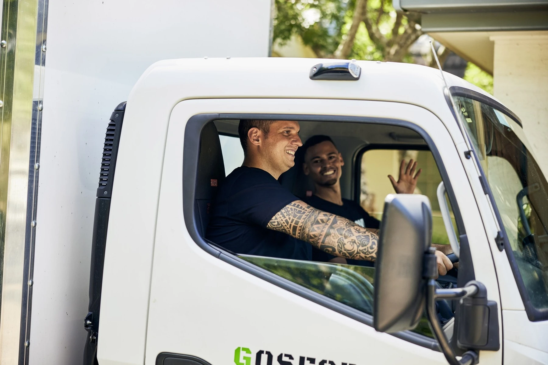 Friendly Upmove removalist team arriving in truck for bulky waste collection