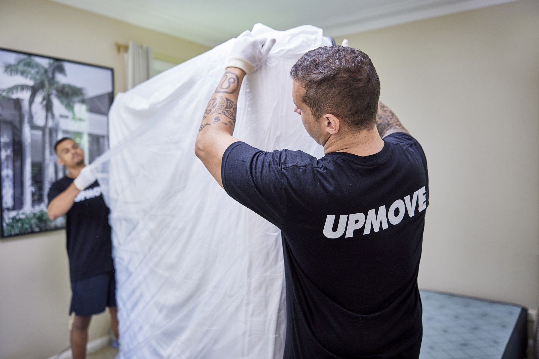 removalists wrapping mattress