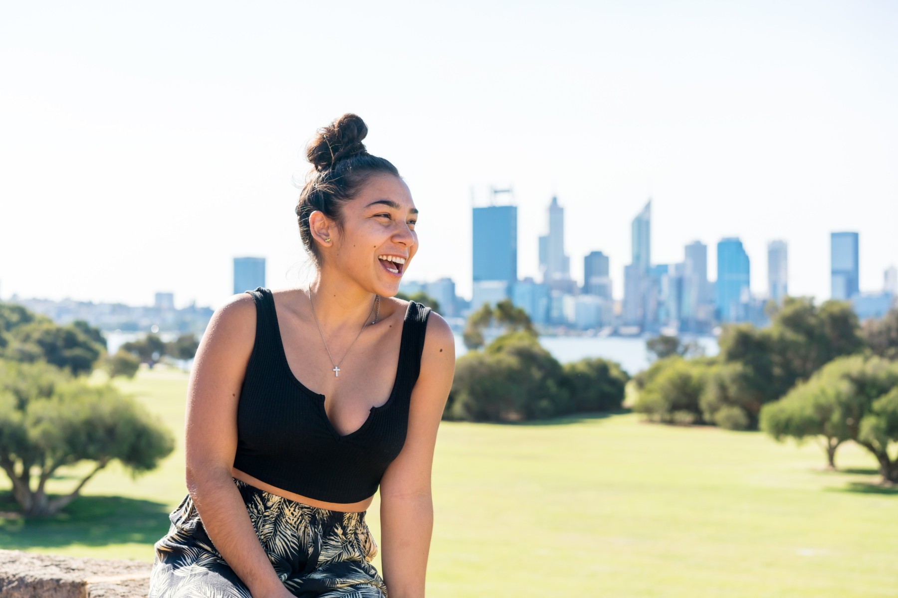 woman laughing in South Perth with Perth city skyline