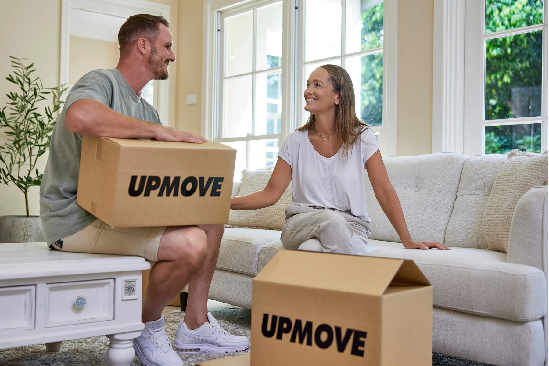 couple with removalist boxes