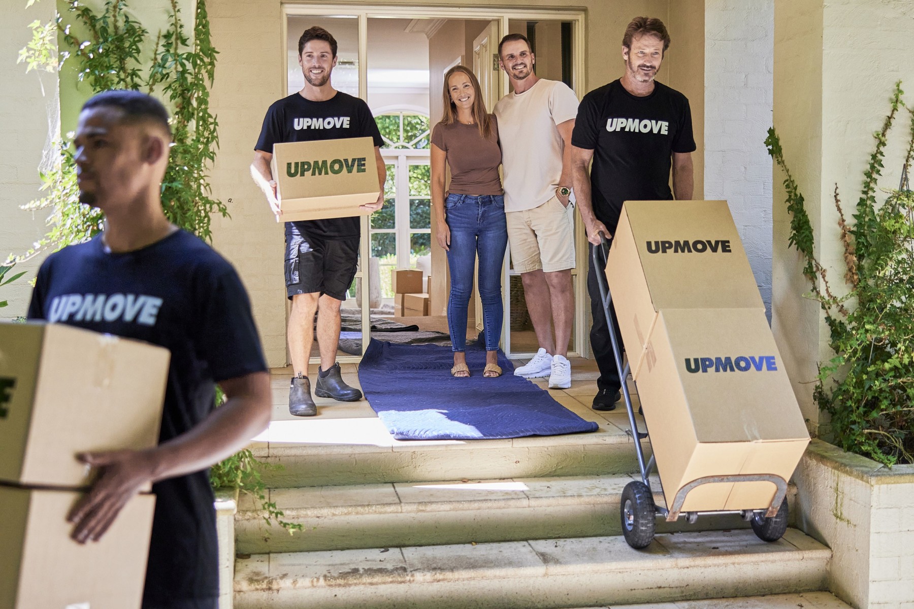 Dedicated Upmove interstate removalist moving boxes out of home.