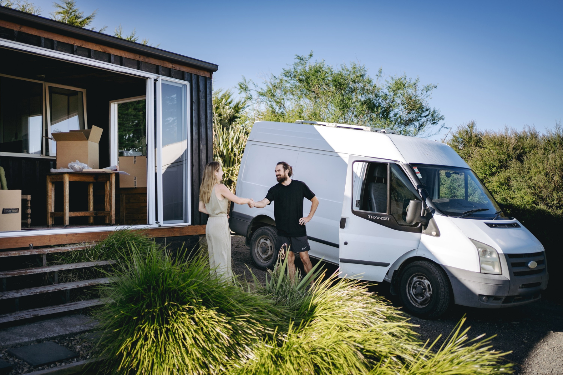 woman shaking hands with removalist