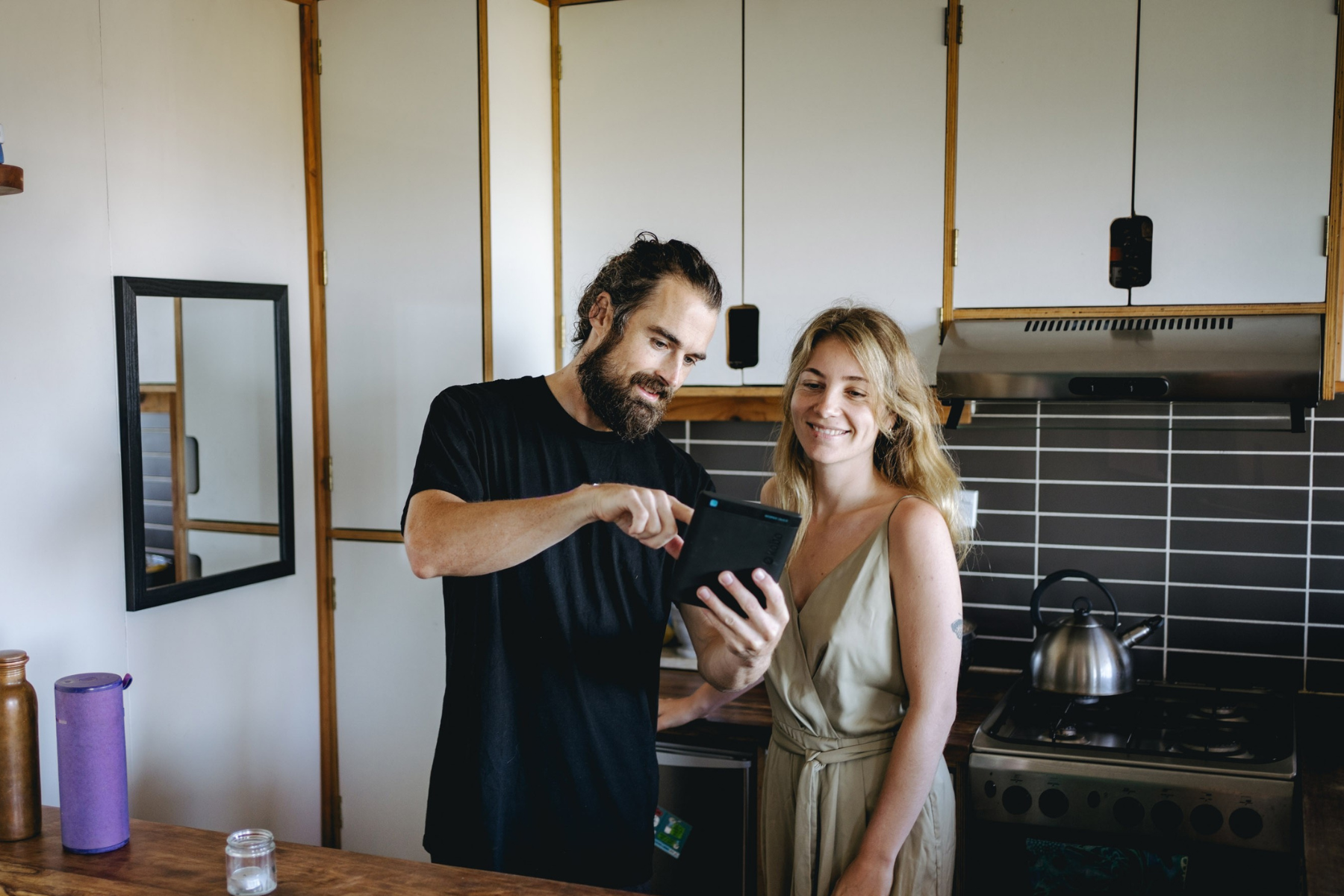 removalist and homeowner in kitchen