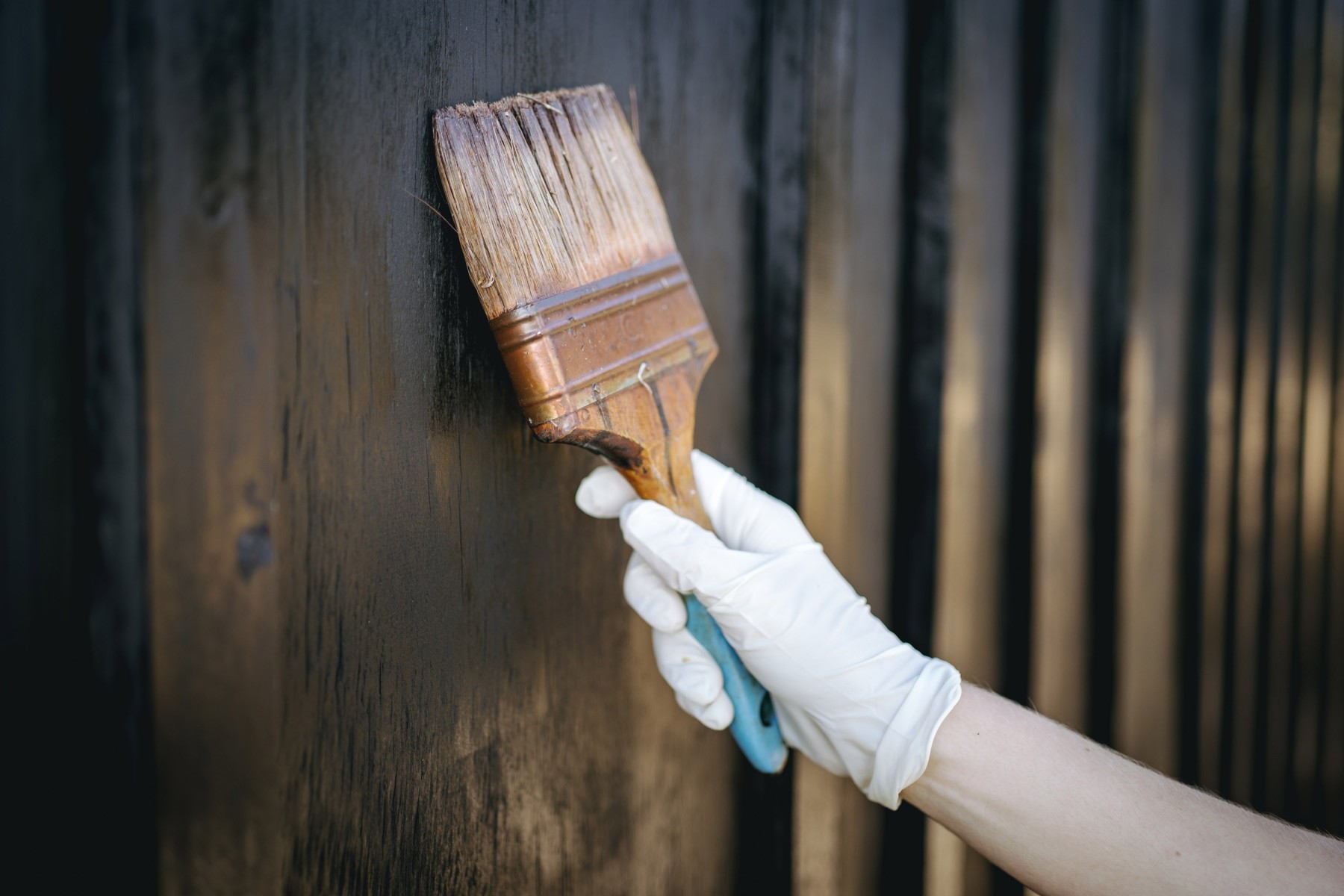 Person repainting new home after moving in