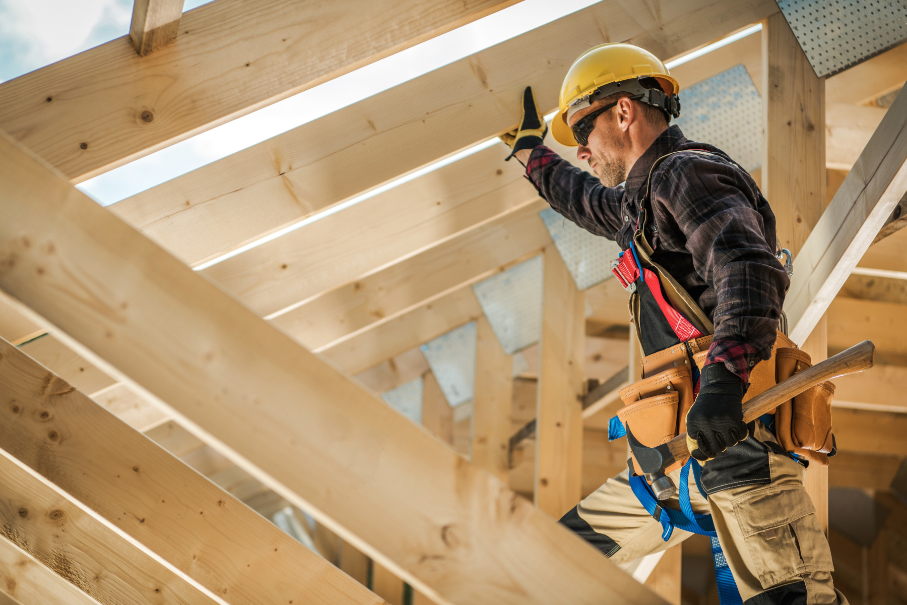 builder with hammer building new house