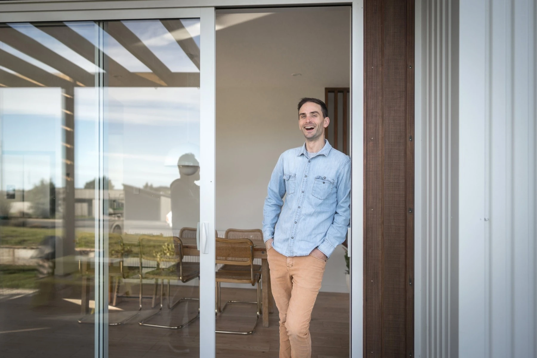 man standing at the door of his new home
