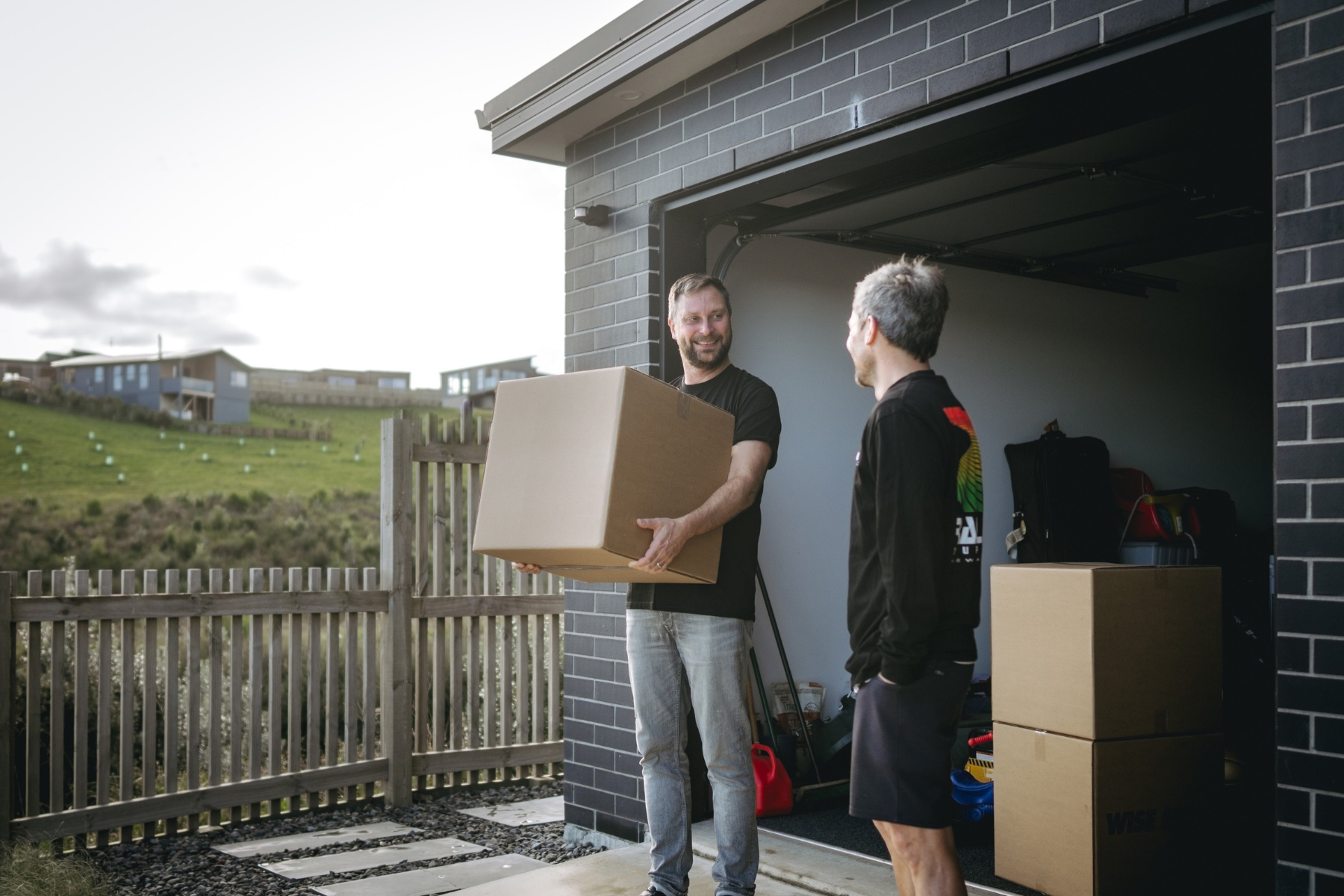 removalist with box & homeowner