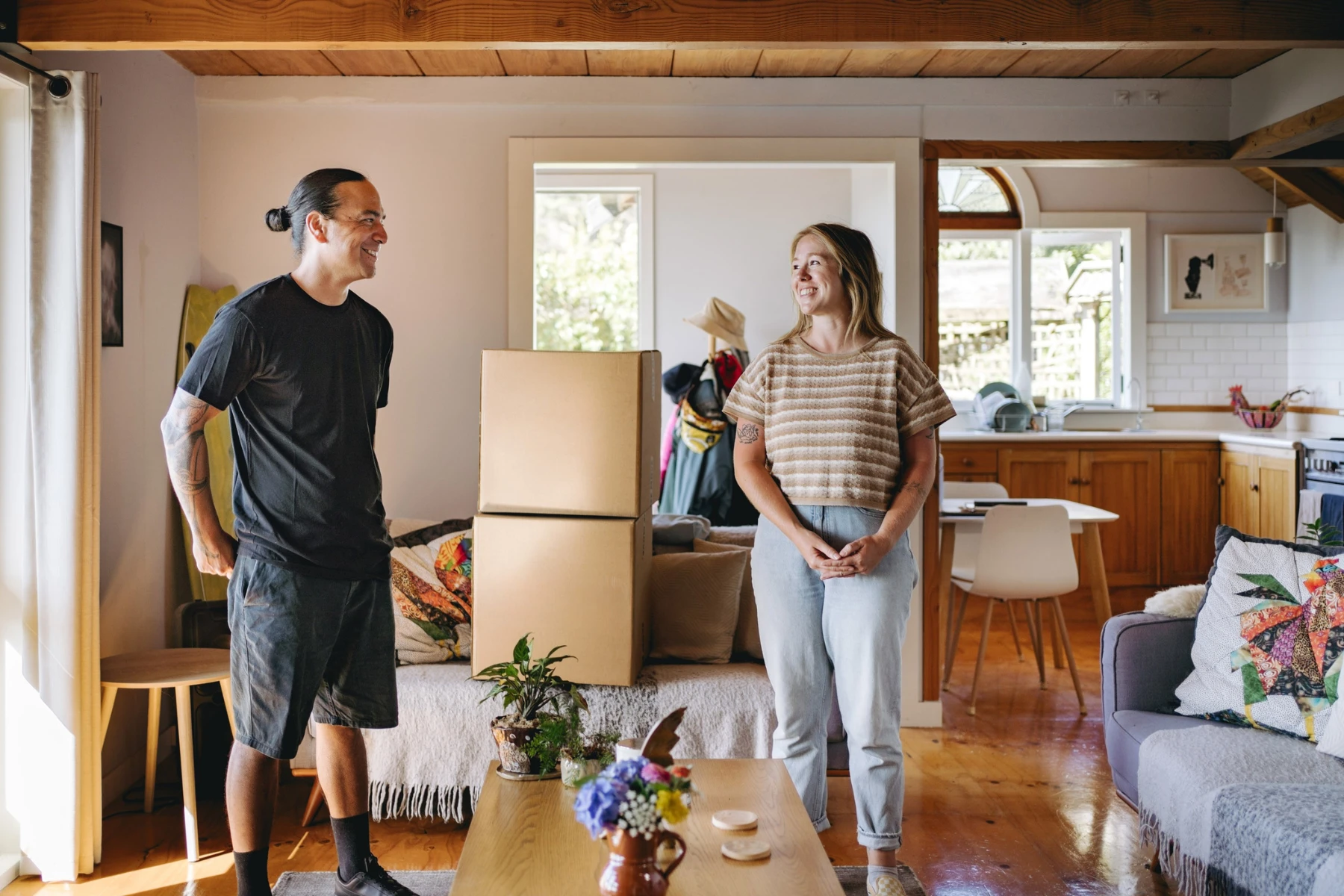 removalist and woman standing with boxes