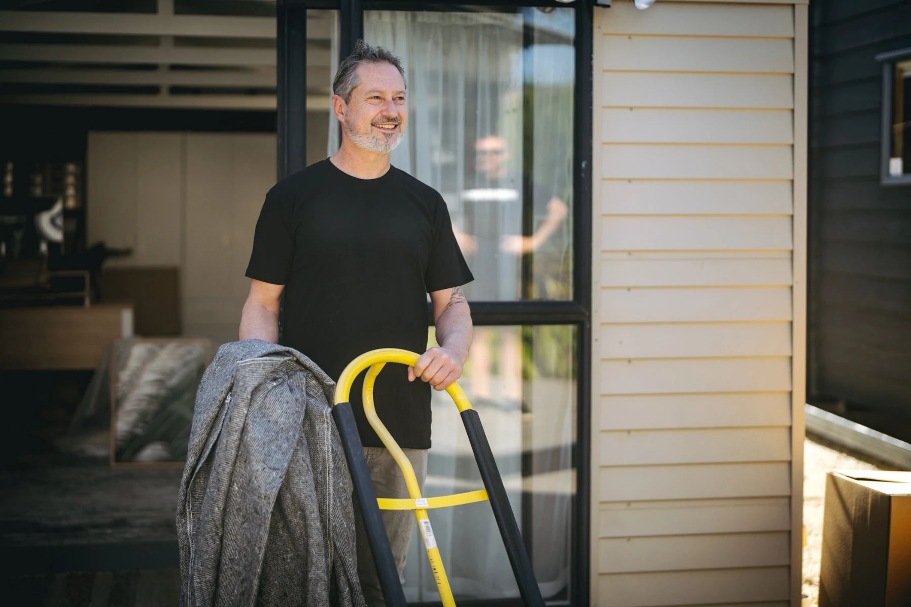 removalist with trolley and blankets