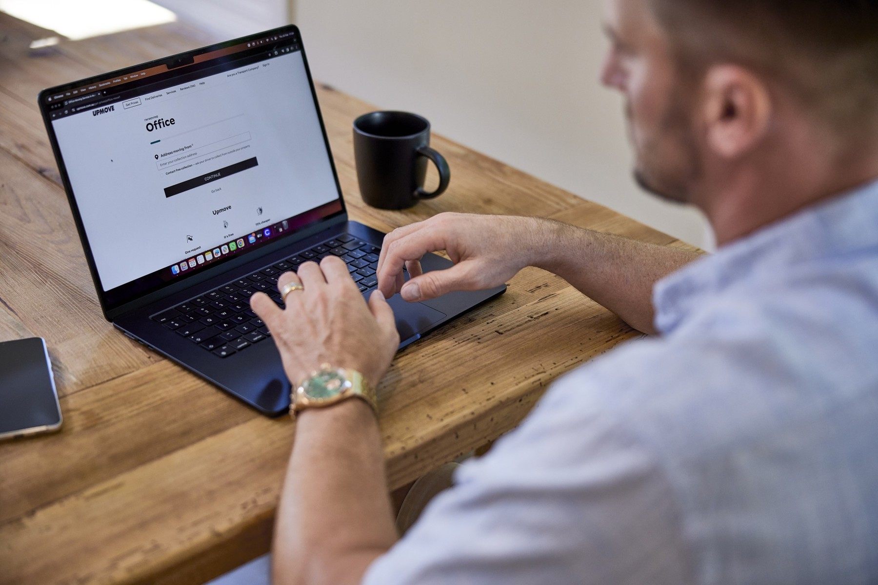 man sitting at office desk
