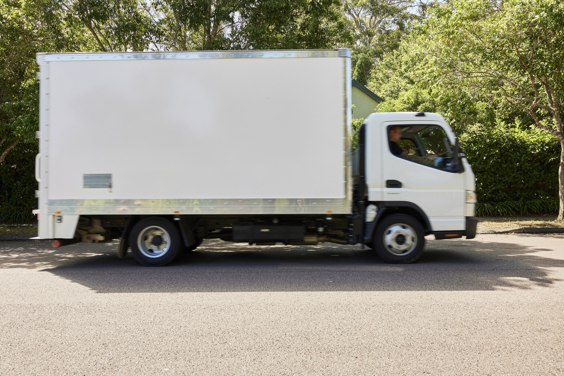 Moving truck outside Australian home preparing for interstate relocation