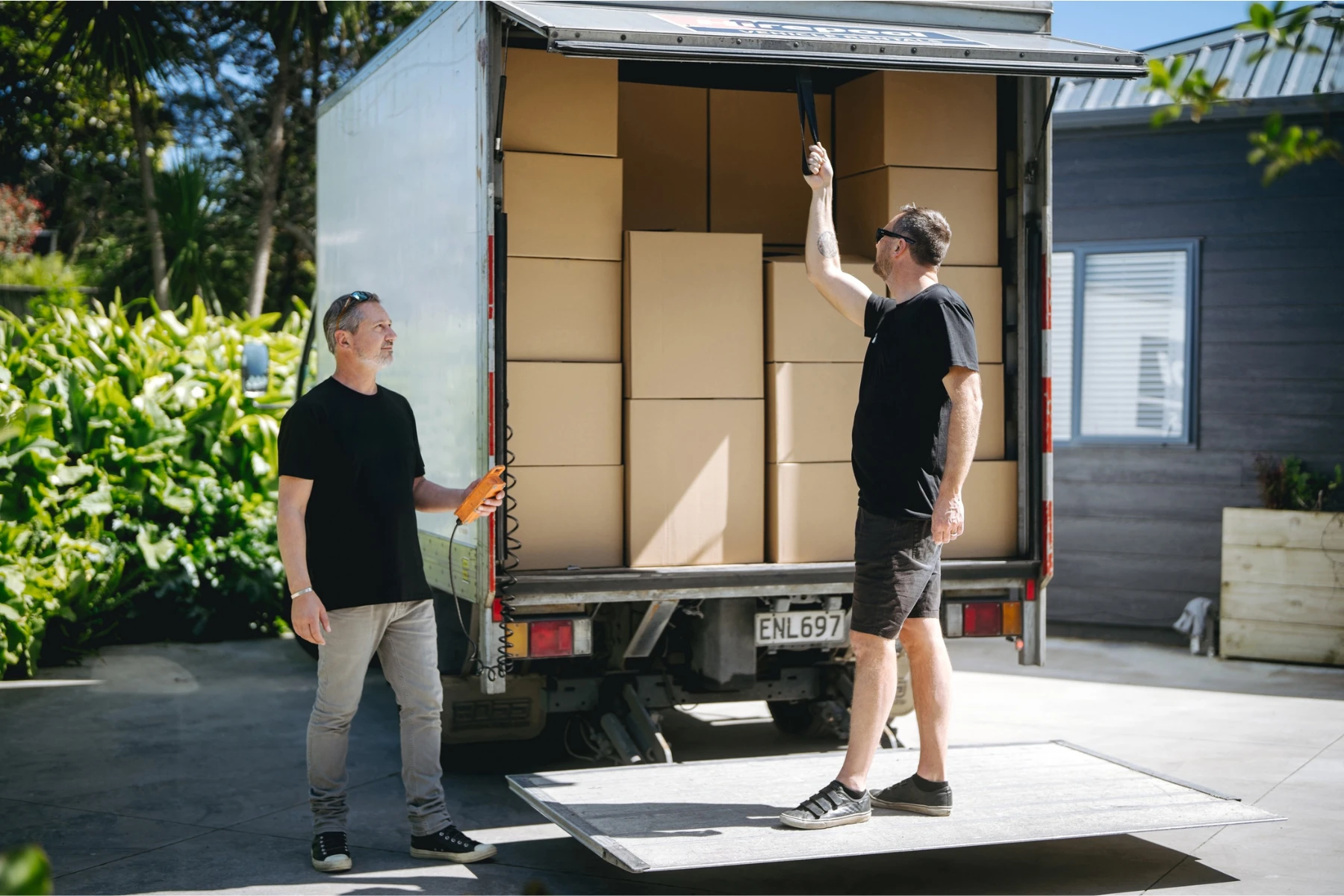 two removalists after loading a truck