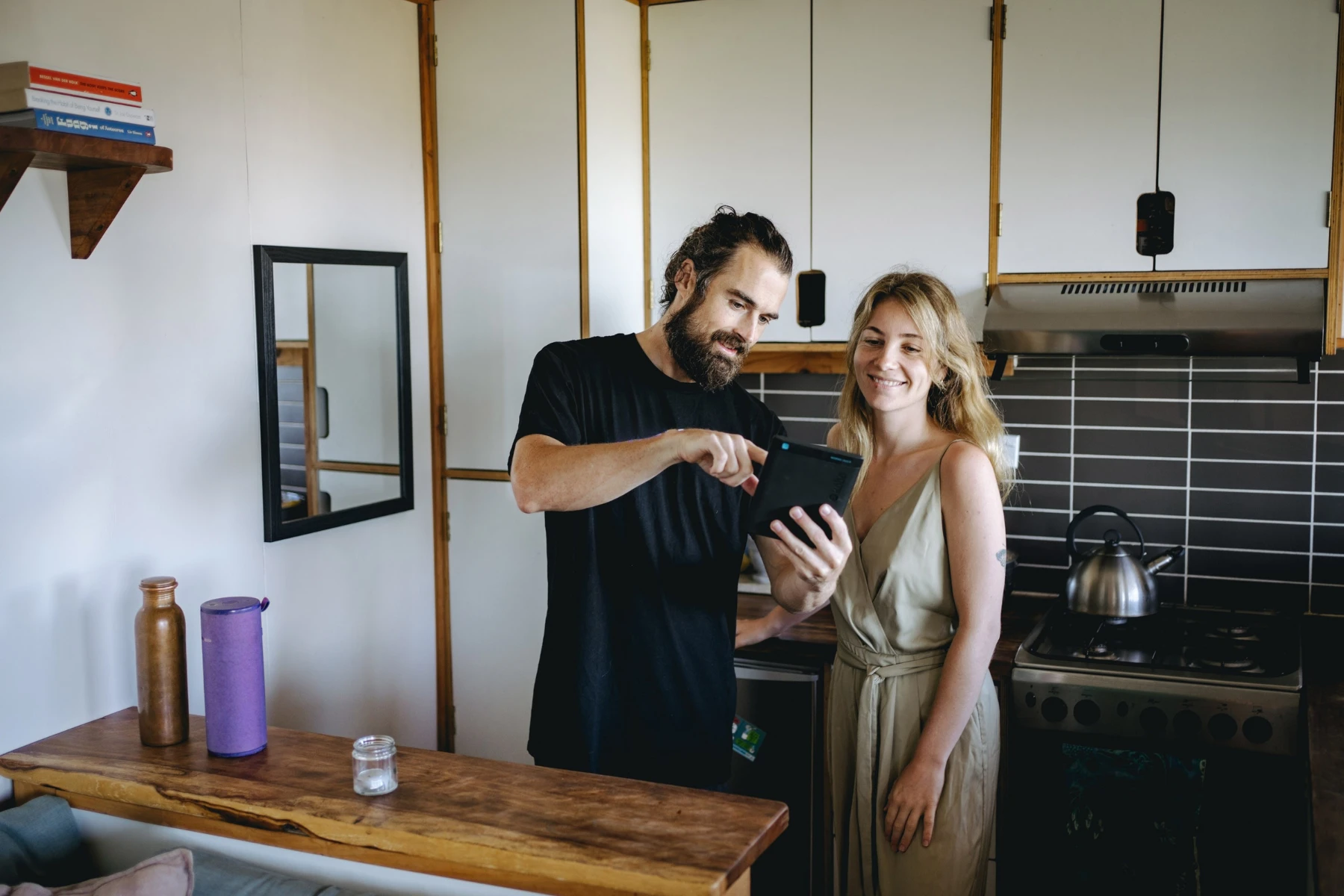 removalist with tablet talking to woman