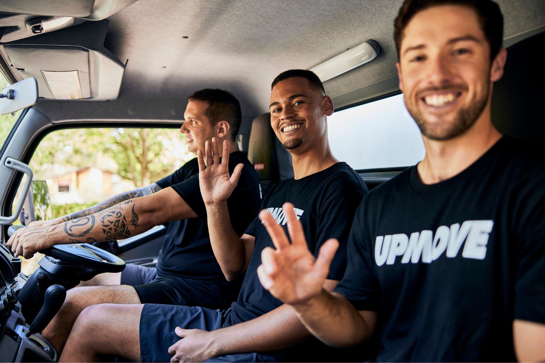 Hard waste removal team waving in truck in Adelaide