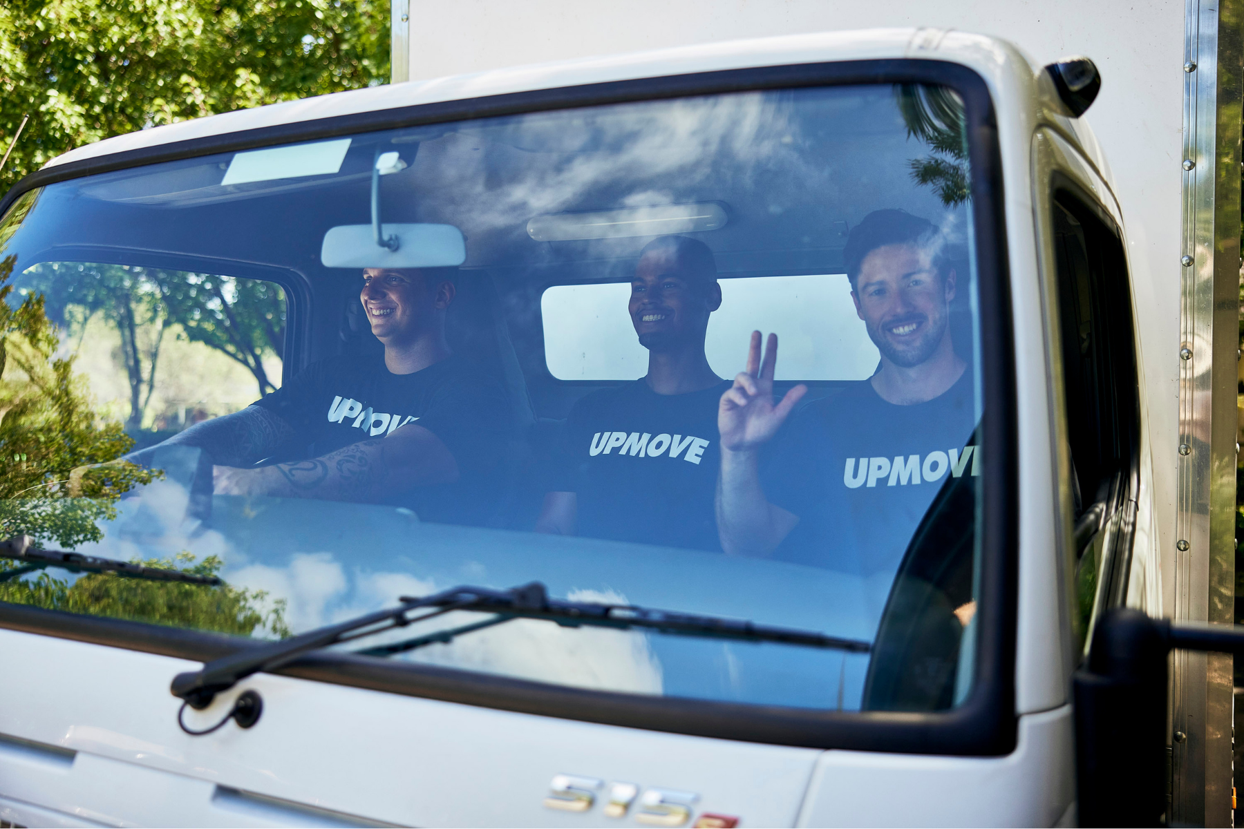 Upmove moving team in moving truck for a student move