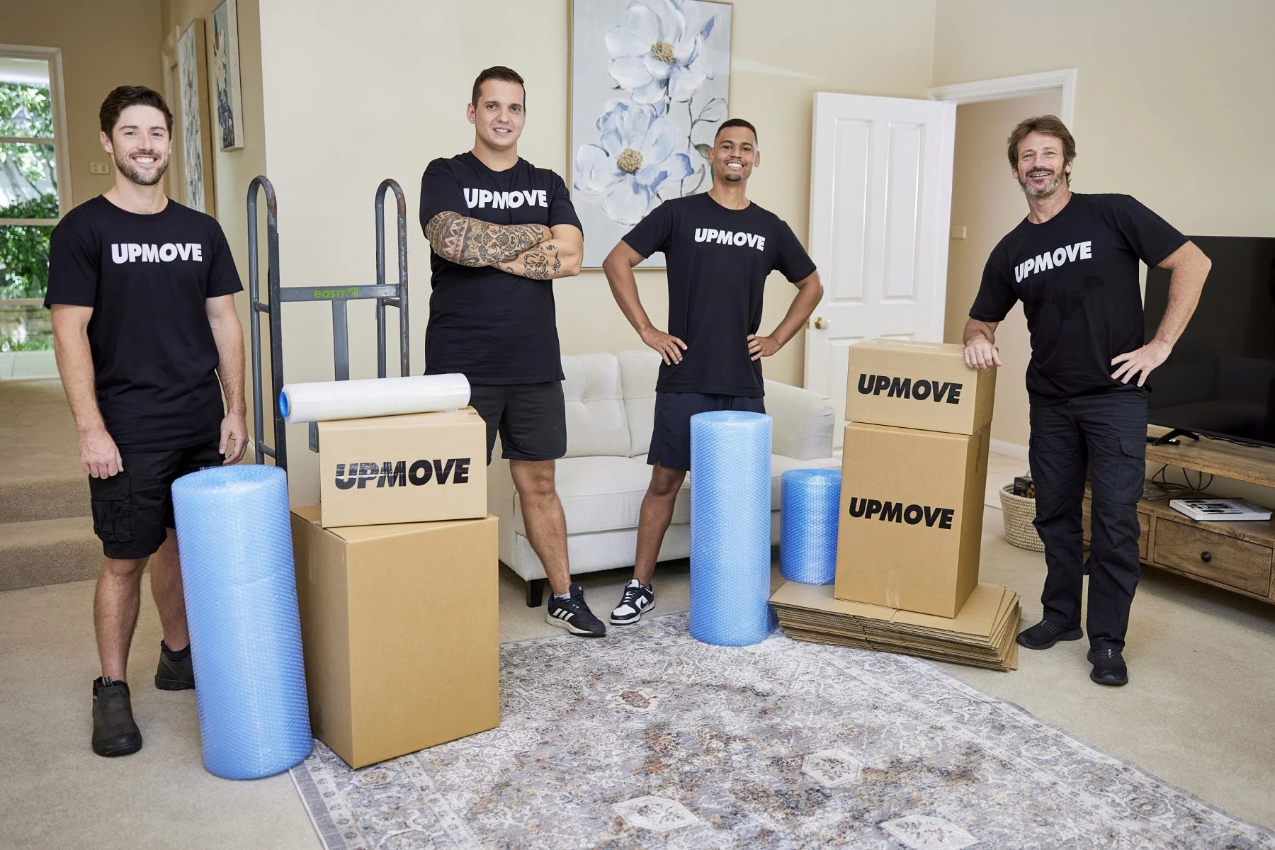 four removalist with boxes and bubblewrap