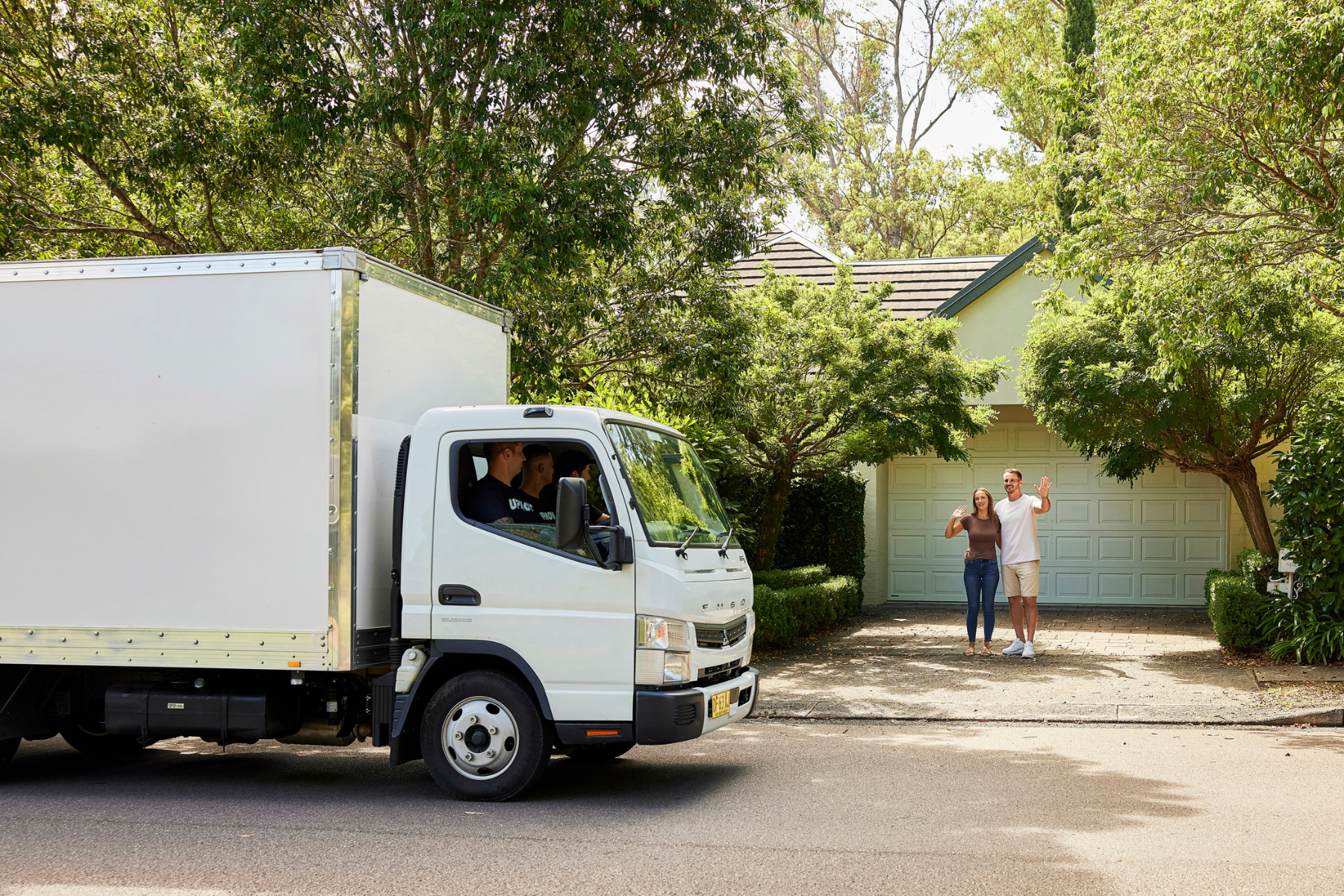 Upmove removal truck greeted by waving customers