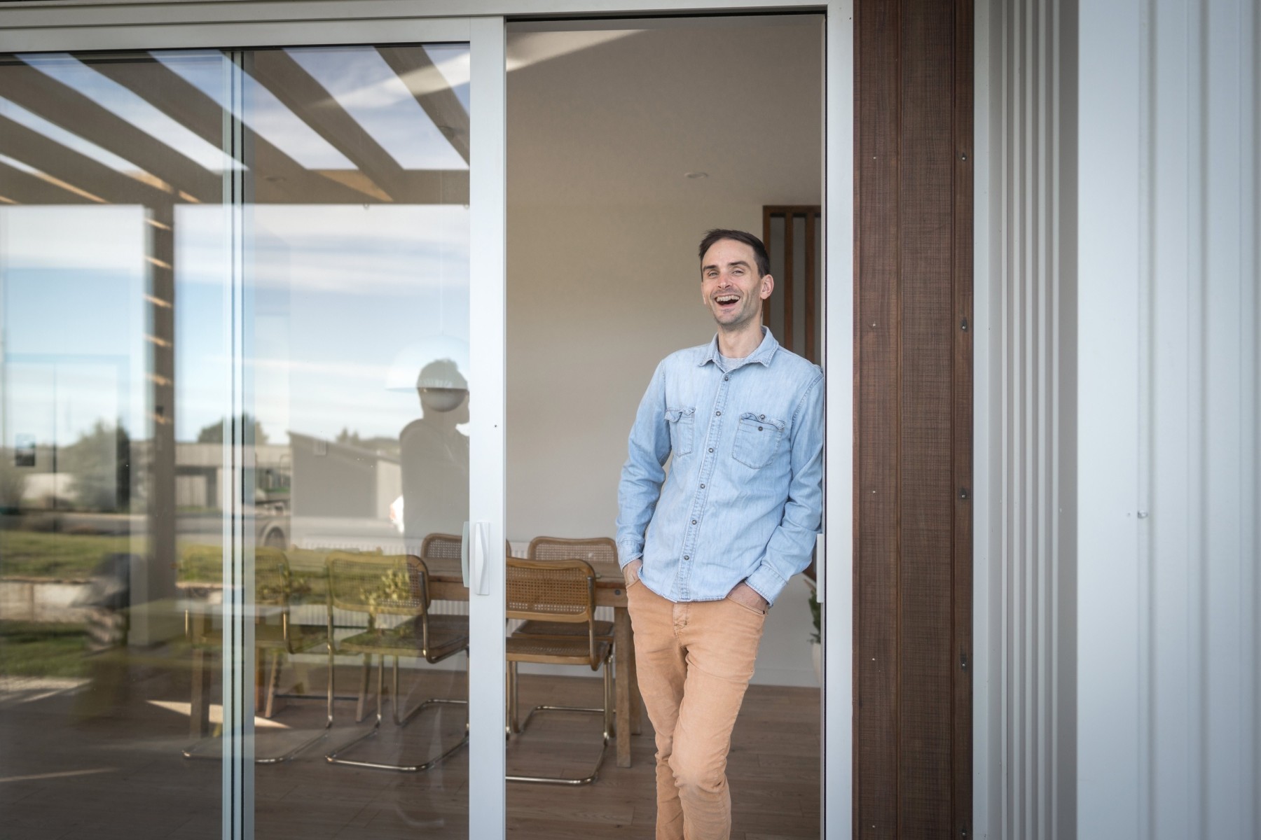man standing at the door of his new home