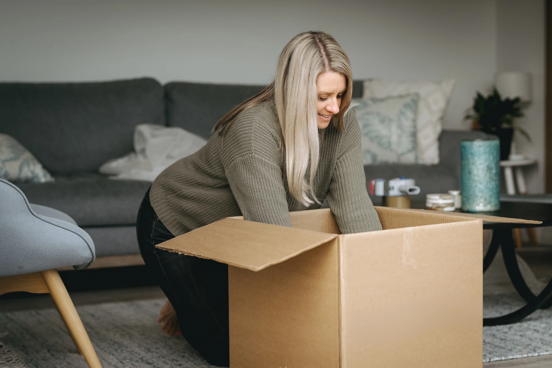 woman packing moving box