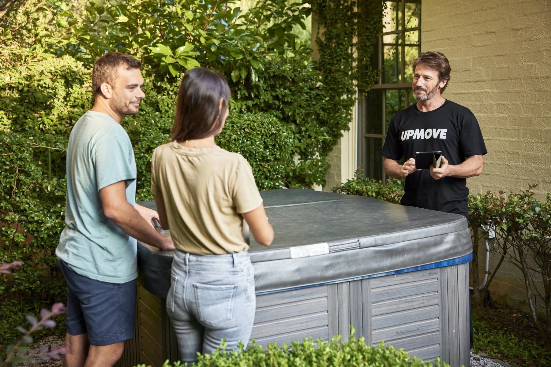 couple and removalist talking near spa