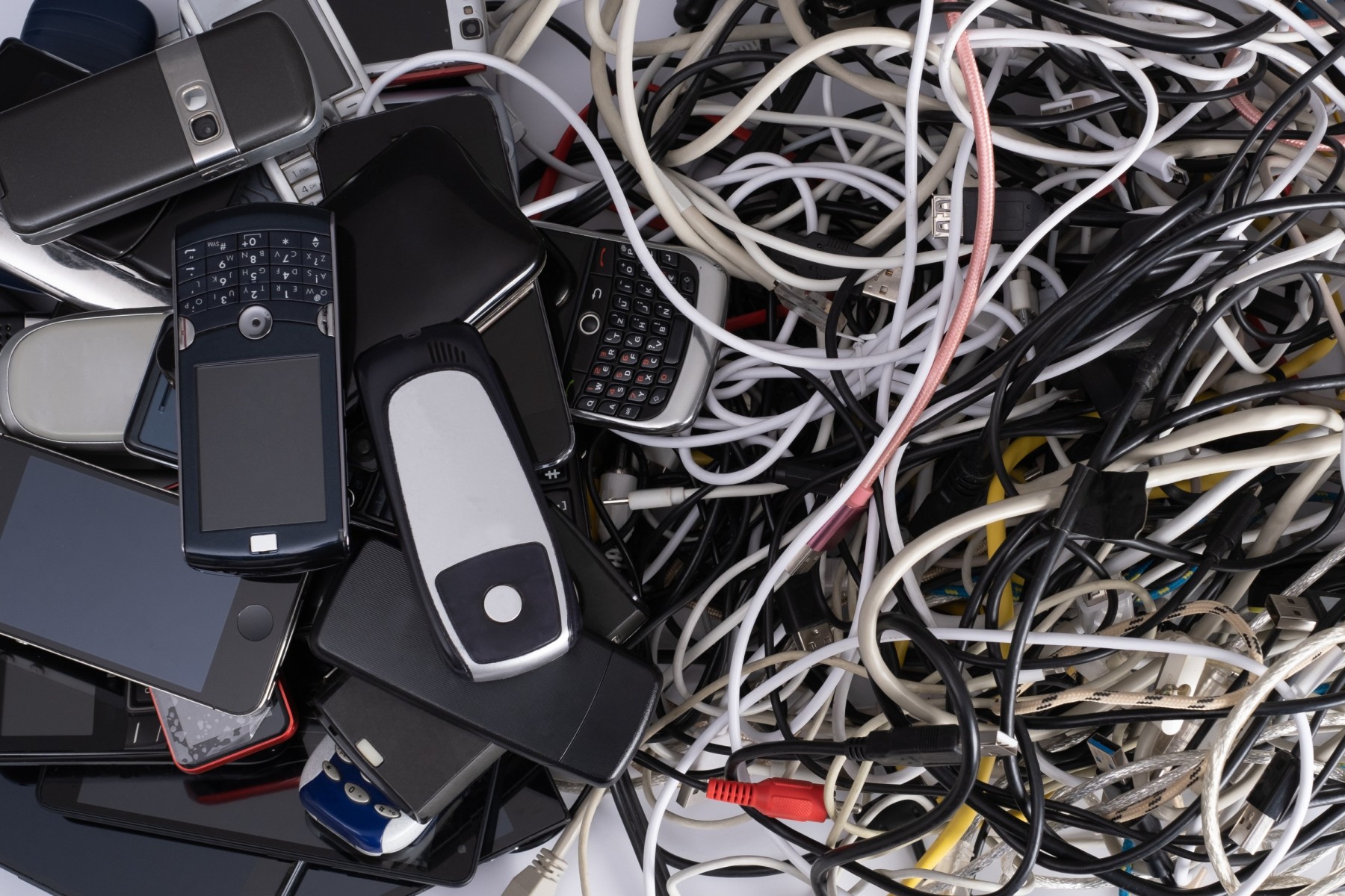 Tangle of cords and old devices to recycle