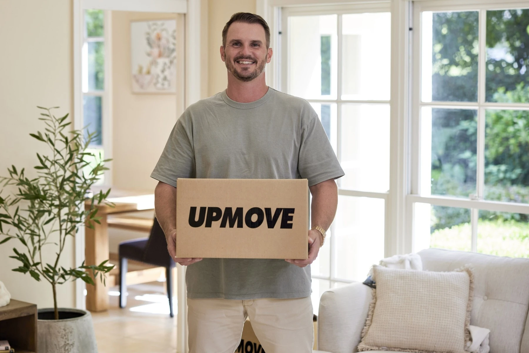 man carrying moving box