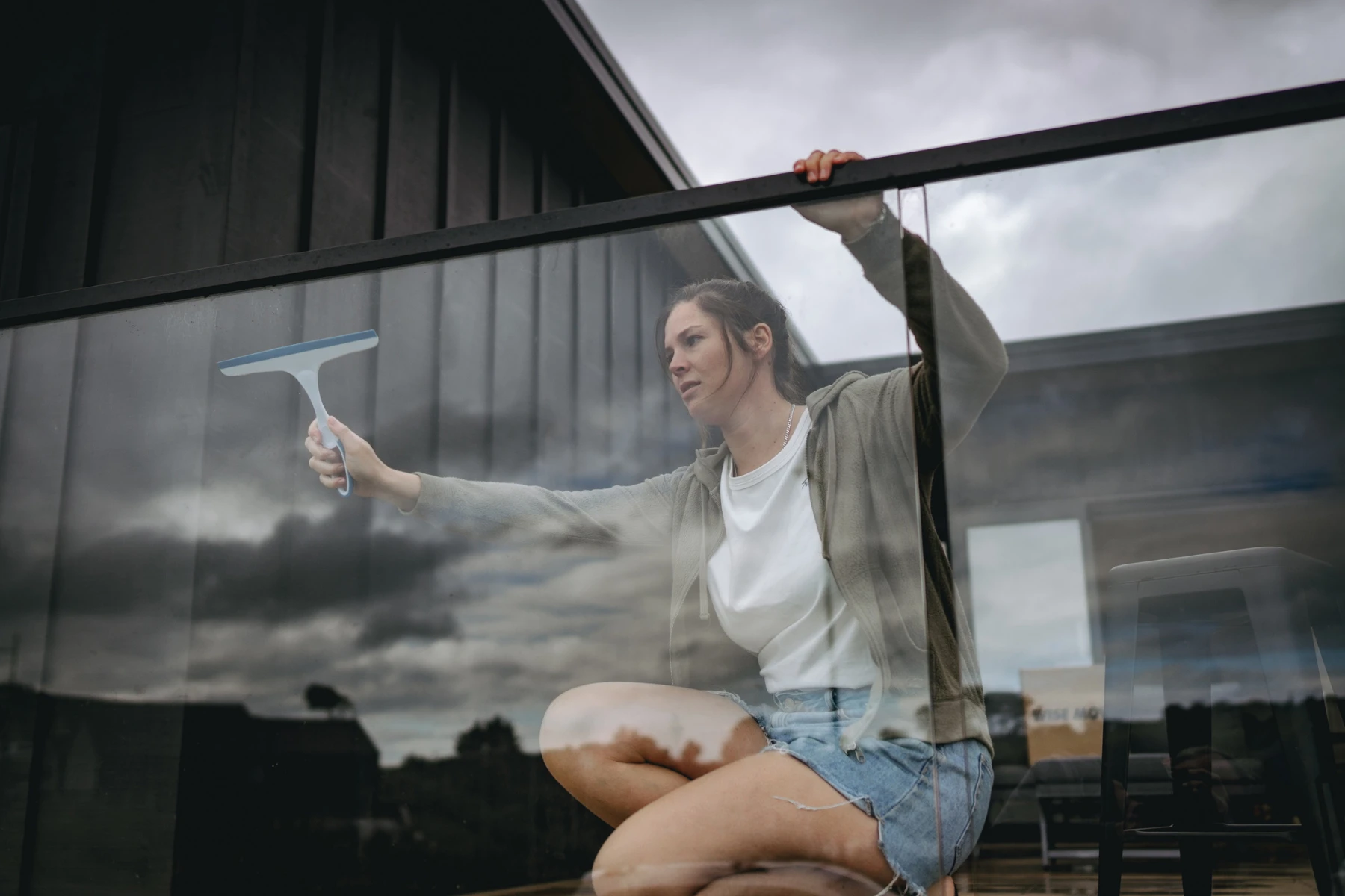 woman cleaning glass