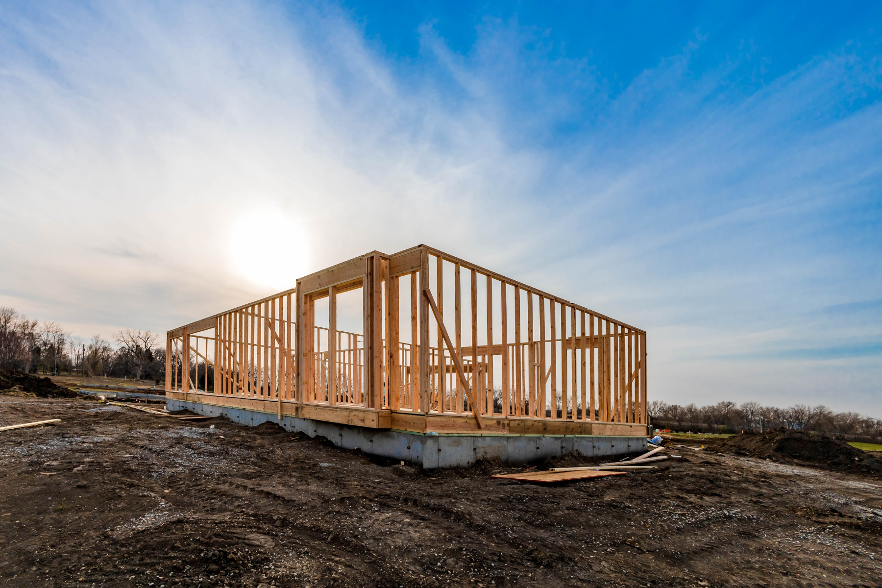 builder with hammer buidling new house