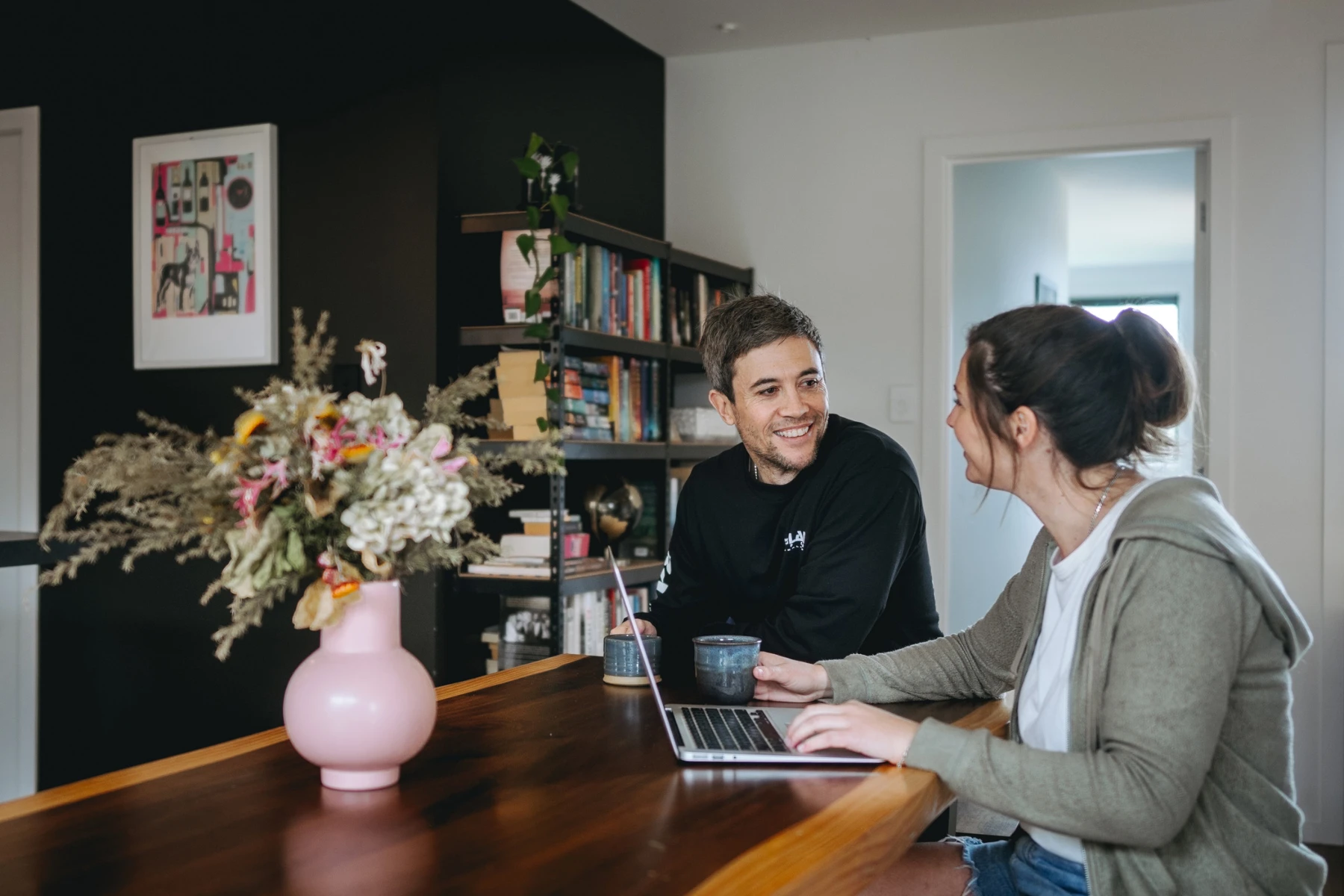 couple siting with laptop