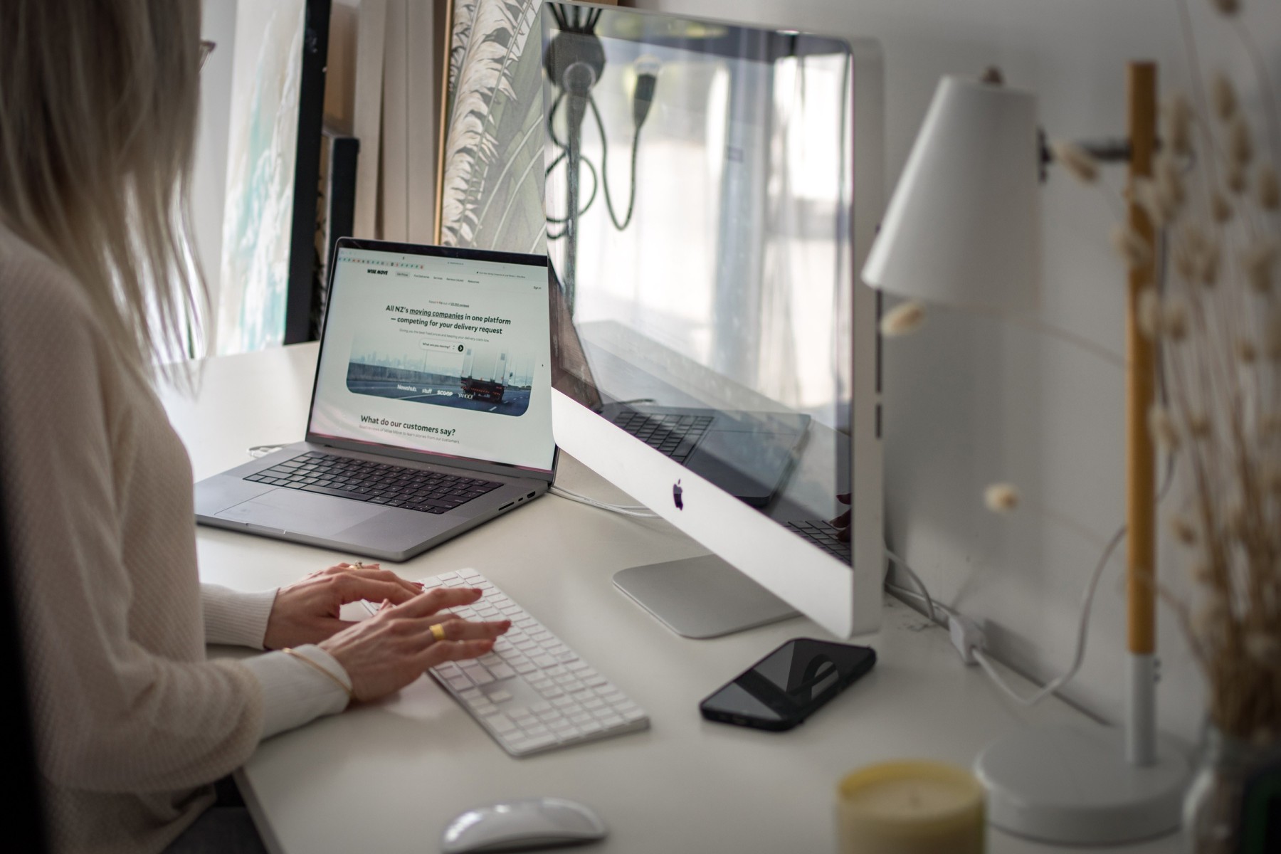 woman sitting at desk with typing