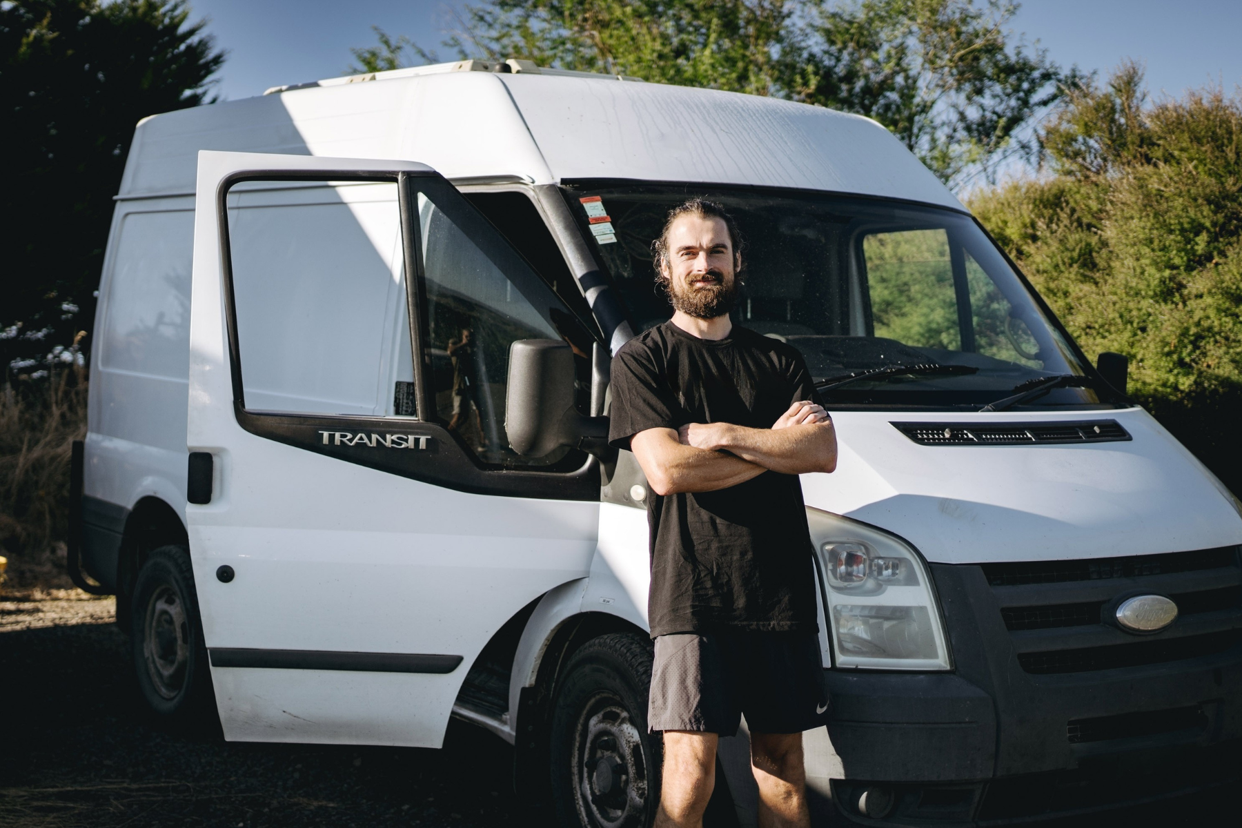 removalist standing in front of moving van.png