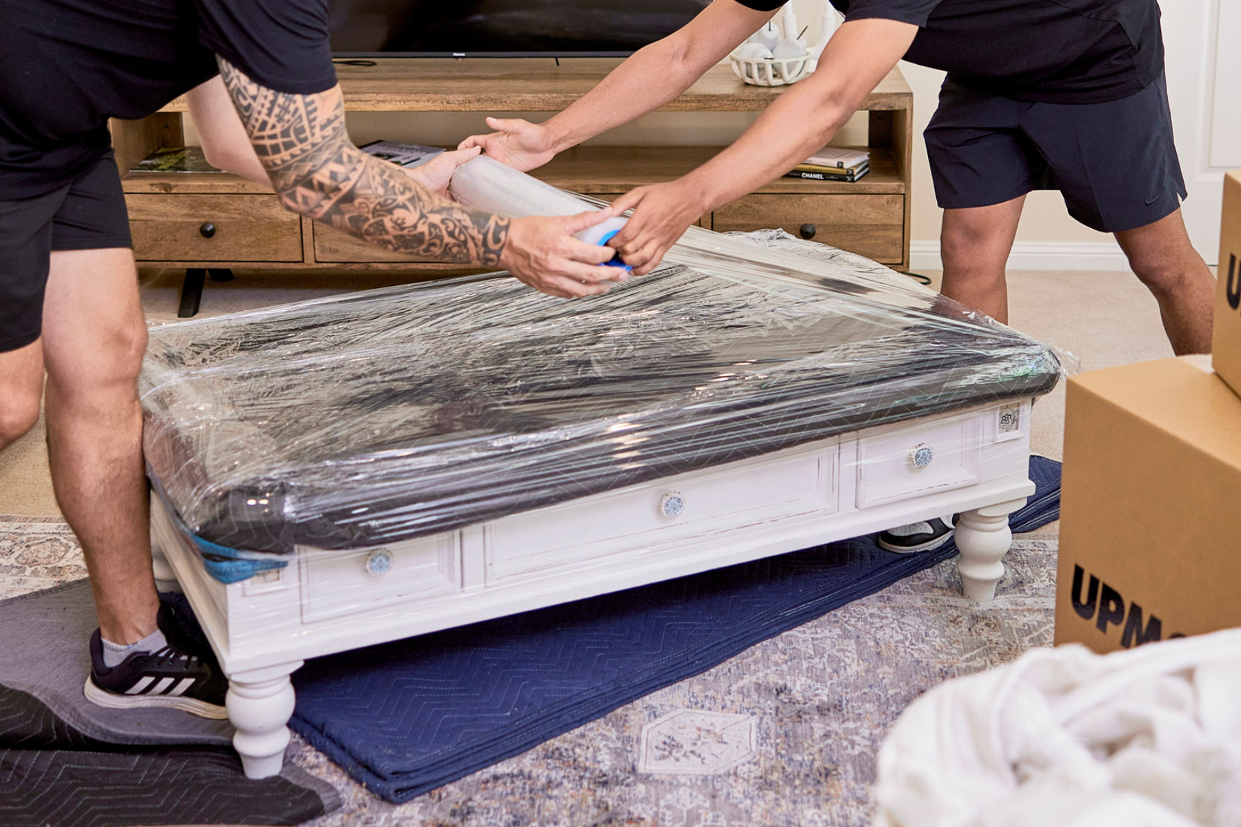 removalists using plastic wrap